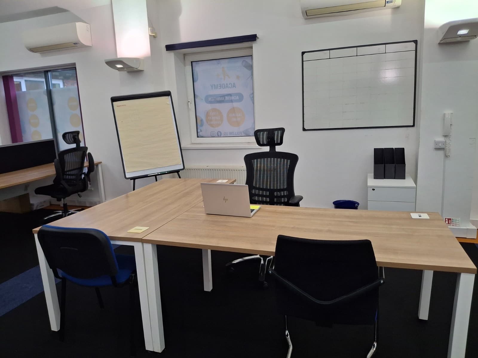 Small-group teaching table with a whiteboard at the Cheadle centre